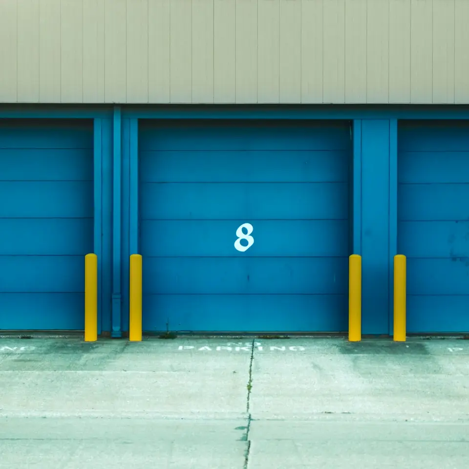 Blue roll-up doors numbered 9, 8 and 7